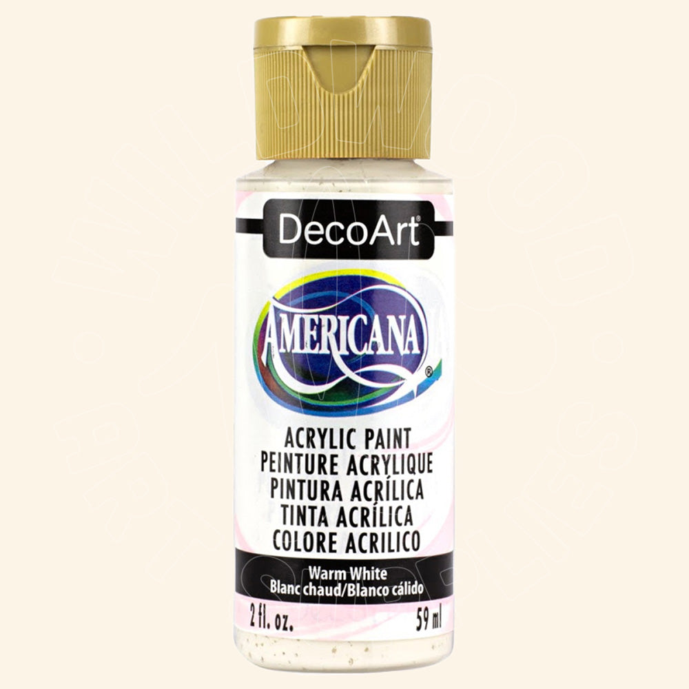 A bottle of DecoArt Americana acrylic paint in the color Warm White, featuring a gold cap and a white label with black and colorful branding.