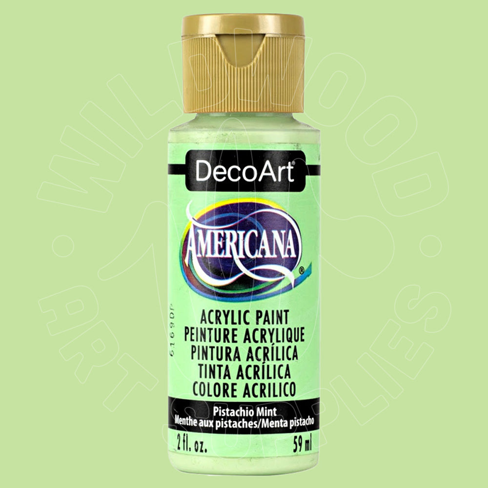 A bottle of DecoArt Americana acrylic paint in the shade Pistachio Mint, featuring a light pistachio green label and a metallic gold cap, set against a matching light pistachio green background.
