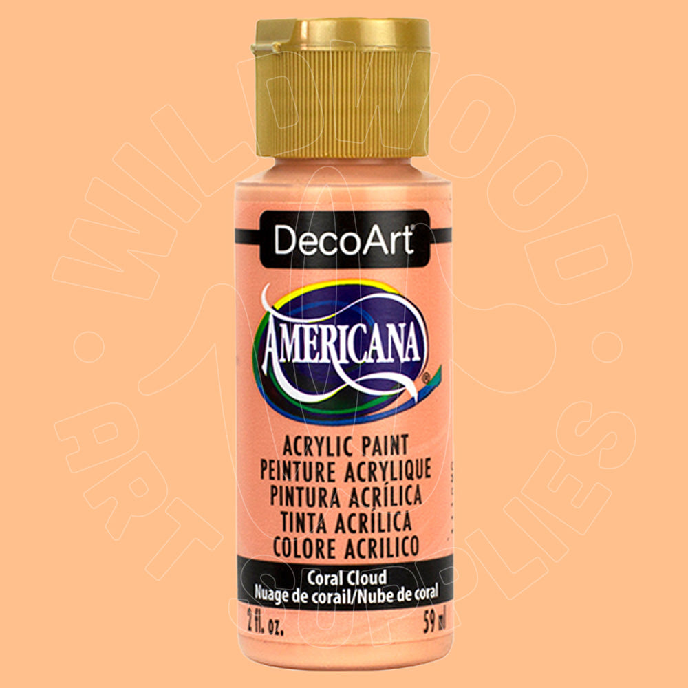 A bottle of DecoArt Americana acrylic paint in the shade Coral Cloud, featuring a peach-colored paint inside and a gold cap, set against a matching peach background.