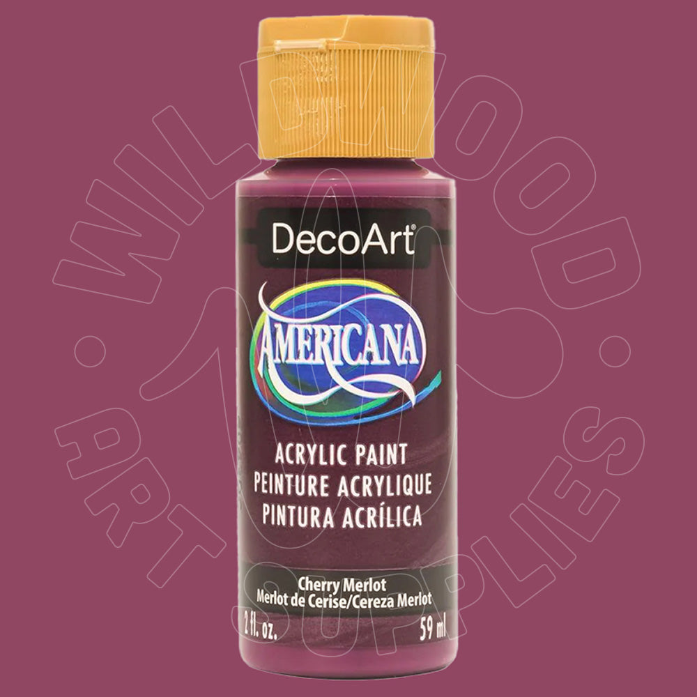 A bottle of DecoArt Americana acrylic paint in the color Cherry Merlot, featuring a gold cap and a dark label with the brand logo, set against a solid plum-colored background.