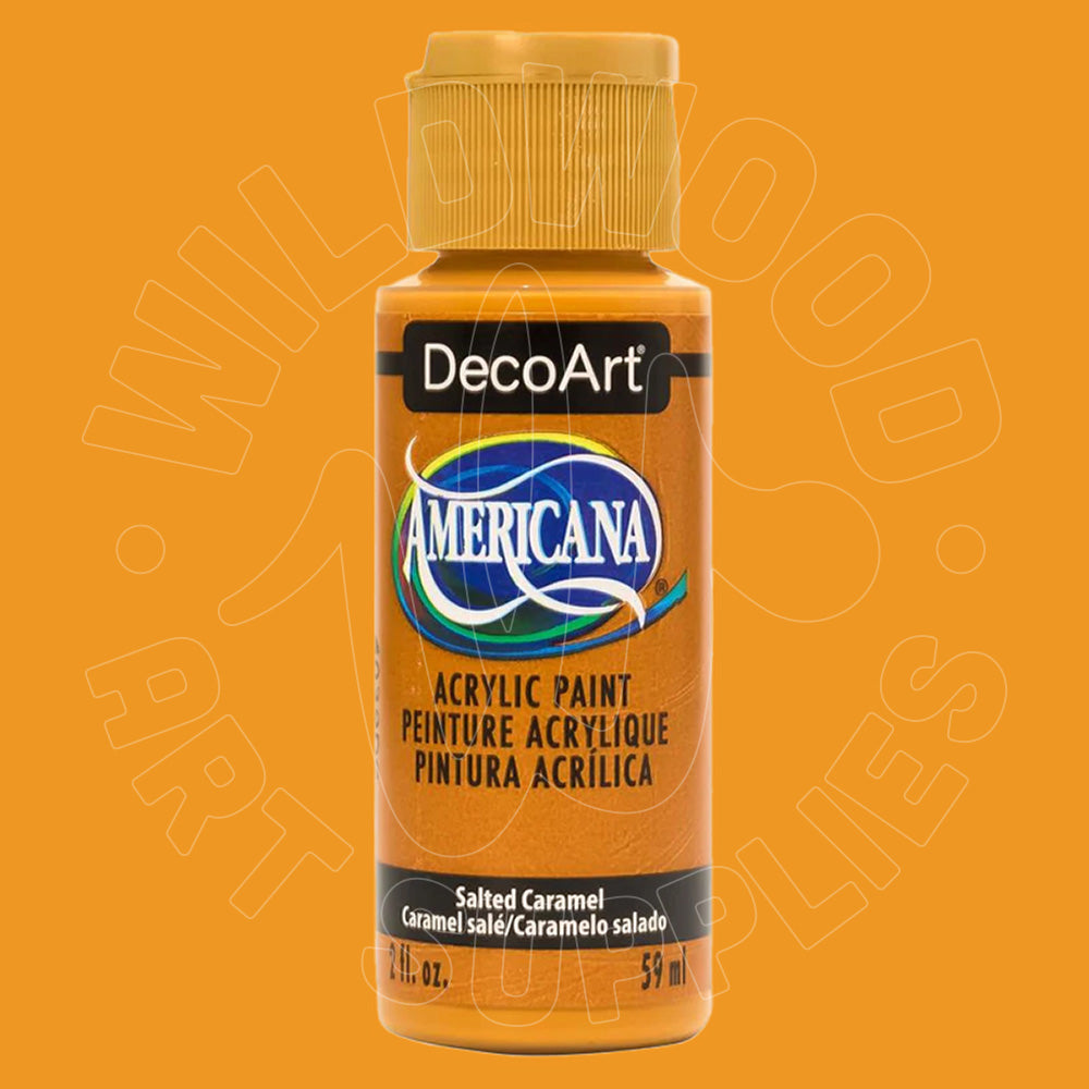 A bottle of DecoArt Americana acrylic paint in the color Salted Caramel, shown against a solid orange background.