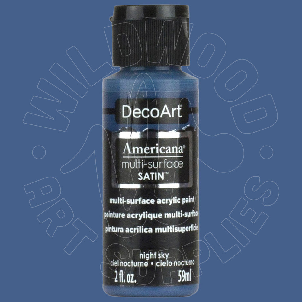A bottle of DecoArt Americana multi-surface satin acrylic paint in the color 'night sky', shown against a solid blue background with a faint watermark.