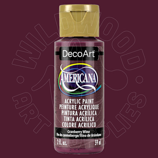 A bottle of DecoArt Americana acrylic paint in the color 'Cranberry Wine', featuring a gold cap and a black label with white text, set against a dark burgundy background with a faint watermark.