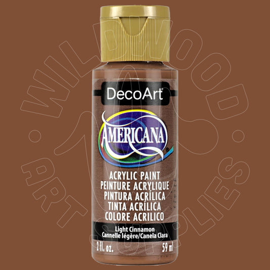 A bottle of DecoArt Americana acrylic paint in the color Light Cinnamon, featuring a brown body, a gold cap, and a black label with the DecoArt logo.