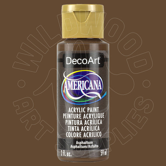 A bottle of DecoArt Americana acrylic paint in the color Asphalt, featuring a gold cap and a black label with a blue and white logo, set against a solid brown background.