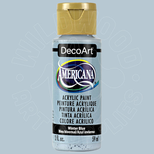 A bottle of DecoArt Americana acrylic paint in the color Winter Blue, featuring a metallic gold cap and a white label with blue and black text.