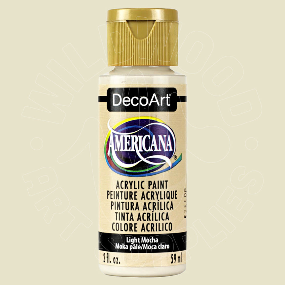 A bottle of DecoArt Americana acrylic paint in the color Light Mocha, featuring a gold cap and a cream-colored label with black and blue branding.