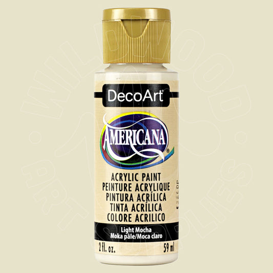 A bottle of DecoArt Americana acrylic paint in the color Light Mocha, featuring a gold cap and a cream-colored label with black and blue branding.
