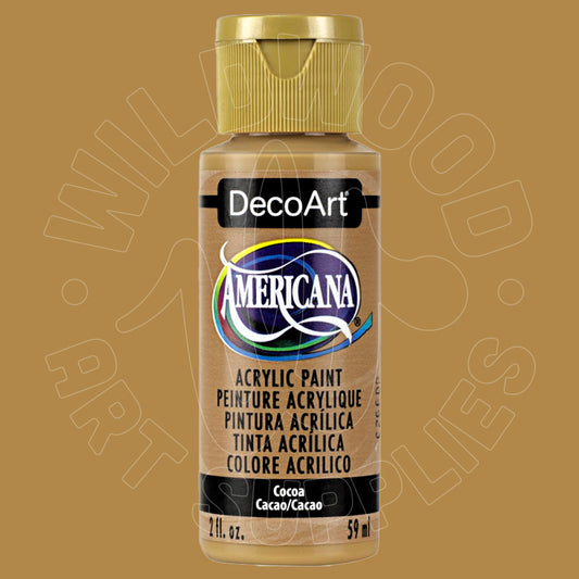 A bottle of DecoArt Americana acrylic paint in the shade Cocoa (Cacao/Cacao), featuring a gold cap and a beige label on a matching brown background.