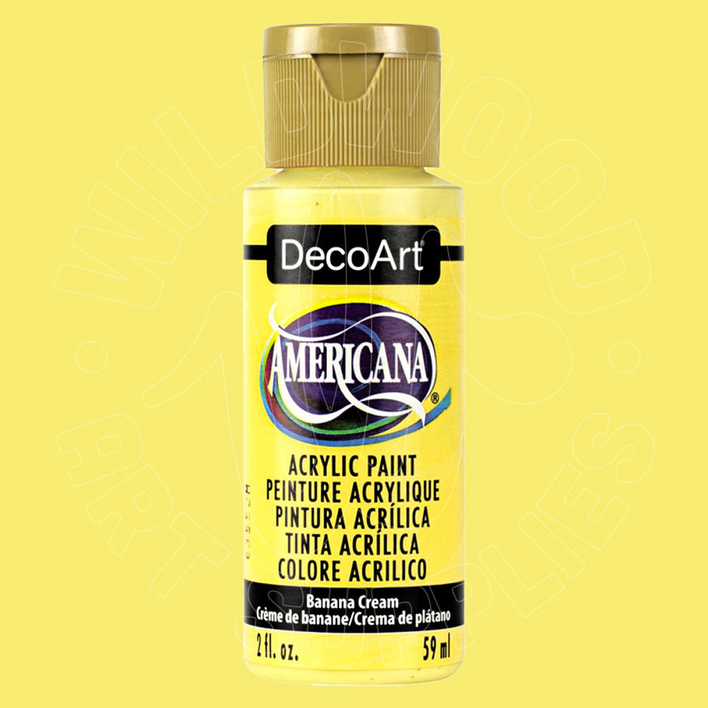 A bottle of DecoArt Americana acrylic paint in Banana Cream, featuring a bright yellow label and a metallic gold cap, set against a solid pale yellow background.