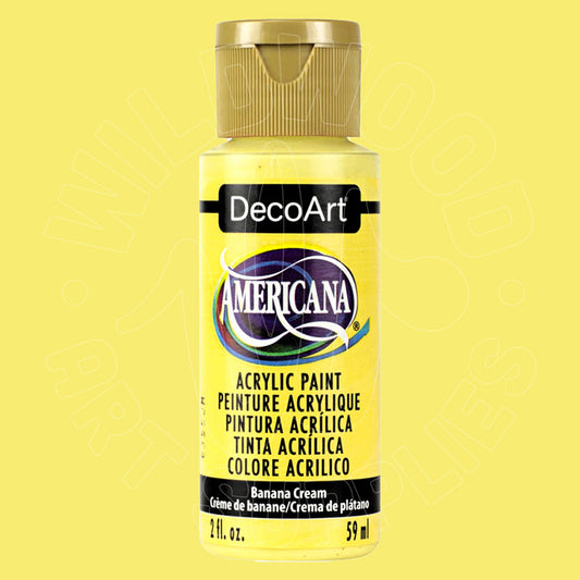 A bottle of DecoArt Americana acrylic paint in Banana Cream, featuring a bright yellow label and a metallic gold cap, set against a solid pale yellow background.