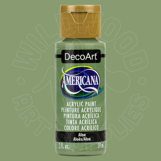 A bottle of DecoArt Americana acrylic paint in the color 'Aloe', featuring a light green body, a gold cap, and a black label with white text, set against a solid sage green background.