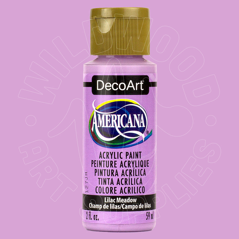 A bottle of DecoArt Americana acrylic paint in the shade Lilac Meadow, featuring a light purple body with a metallic gold cap, set against a solid lavender background.
