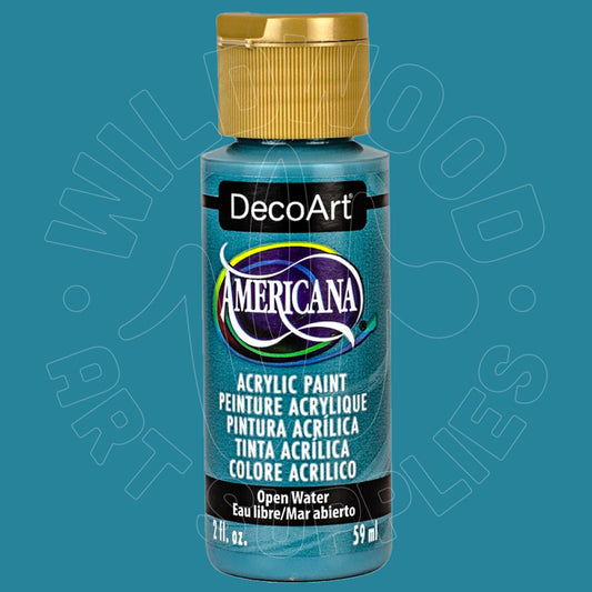 A bottle of DecoArt Americana acrylic paint in the shade Blue Water, featuring a metallic teal-blue label and a gold cap, set against a solid teal-blue background with a faint watermark.
