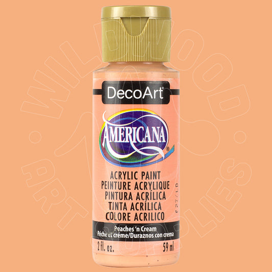 A bottle of DecoArt Americana acrylic paint in the color 'Peaches 'n Cream' (peach), featuring a gold cap and a peach-colored label, set against a solid peach background.