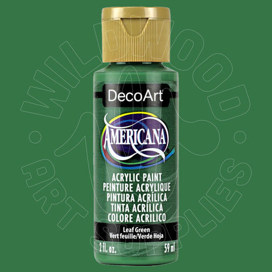 A bottle of DecoArt Americana Leaf Green acrylic paint with a gold cap, centered on a solid green background with a faint watermark.