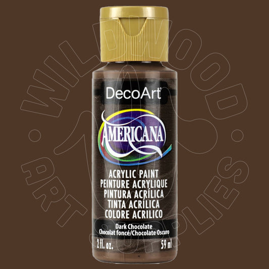 A bottle of DecoArt Americana acrylic paint in the color 'Dark Chocolate' (chocolate oscuro), featuring a gold cap and a black label with a colorful logo, set against a solid dark brown background.