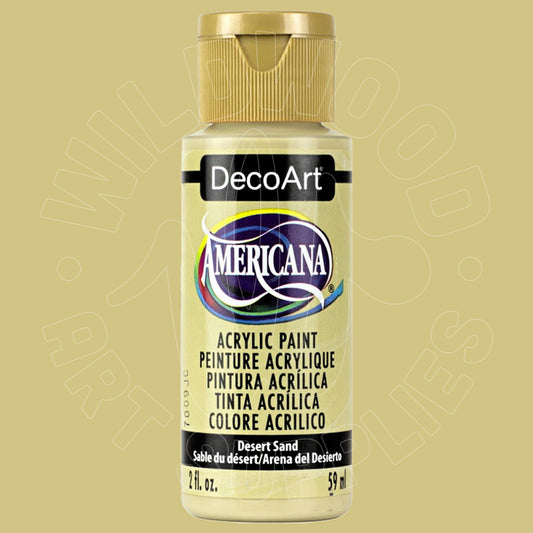 A bottle of DecoArt Americana acrylic paint in the color 'Desert Sand' (Beige), featuring a gold cap and a cream-colored label with black text.