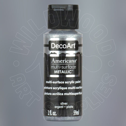 A bottle of DecoArt Americana Metallic multi-surface acrylic paint in silver, featuring a black cap and black label with white text, set against a gray background with a faint watermark.