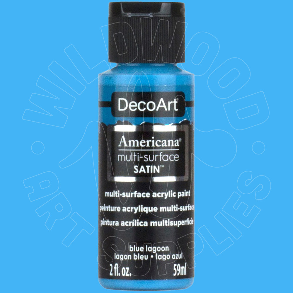 A bottle of DecoArt Americana multi-surface satin acrylic paint in the color blue lagoon, shown against a solid blue background.