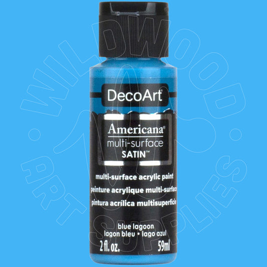 A bottle of DecoArt Americana multi-surface satin acrylic paint in the color blue lagoon, shown against a solid blue background.