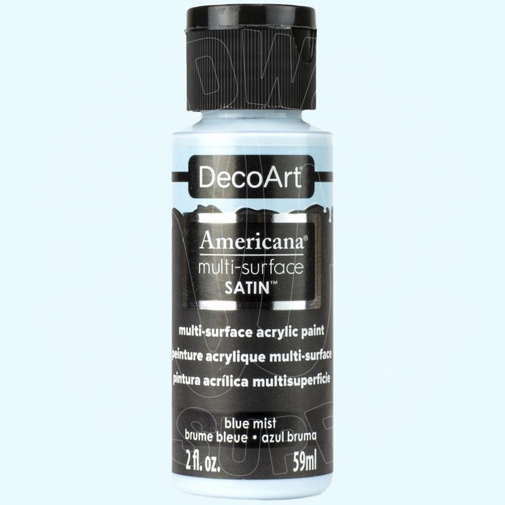 A 59ml bottle of DecoArt Americana multi-surface satin acrylic paint in the color 'blue mist', featuring a black cap and black label on a light blue background.