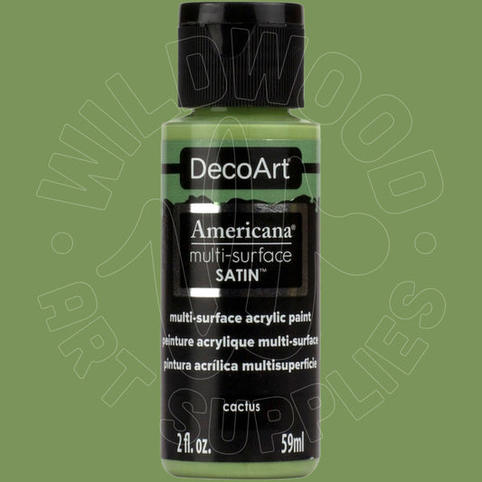 A bottle of DecoArt Americana multi-surface SATIN acrylic paint in the color cactus, featuring a black cap and black label with white text, set against a solid sage green background.