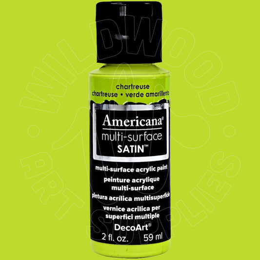A bottle of Americana DecoArt multi-surface satin acrylic paint in chartreuse green, featuring a black cap and black label with white text, set against a solid lime green background.
