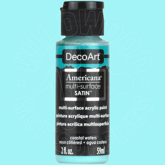 A bottle of DecoArt Americana multi-surface satin acrylic paint in the color 'coastal waters', featuring a black cap and a black label with teal-blue text, set against a solid light blue background.