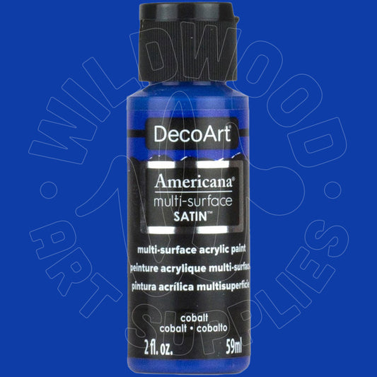A bottle of DecoArt Americana multi-surface SATIN acrylic paint in cobalt blue, featuring a black cap and black label with white text, set against a solid blue background with a faint watermark.