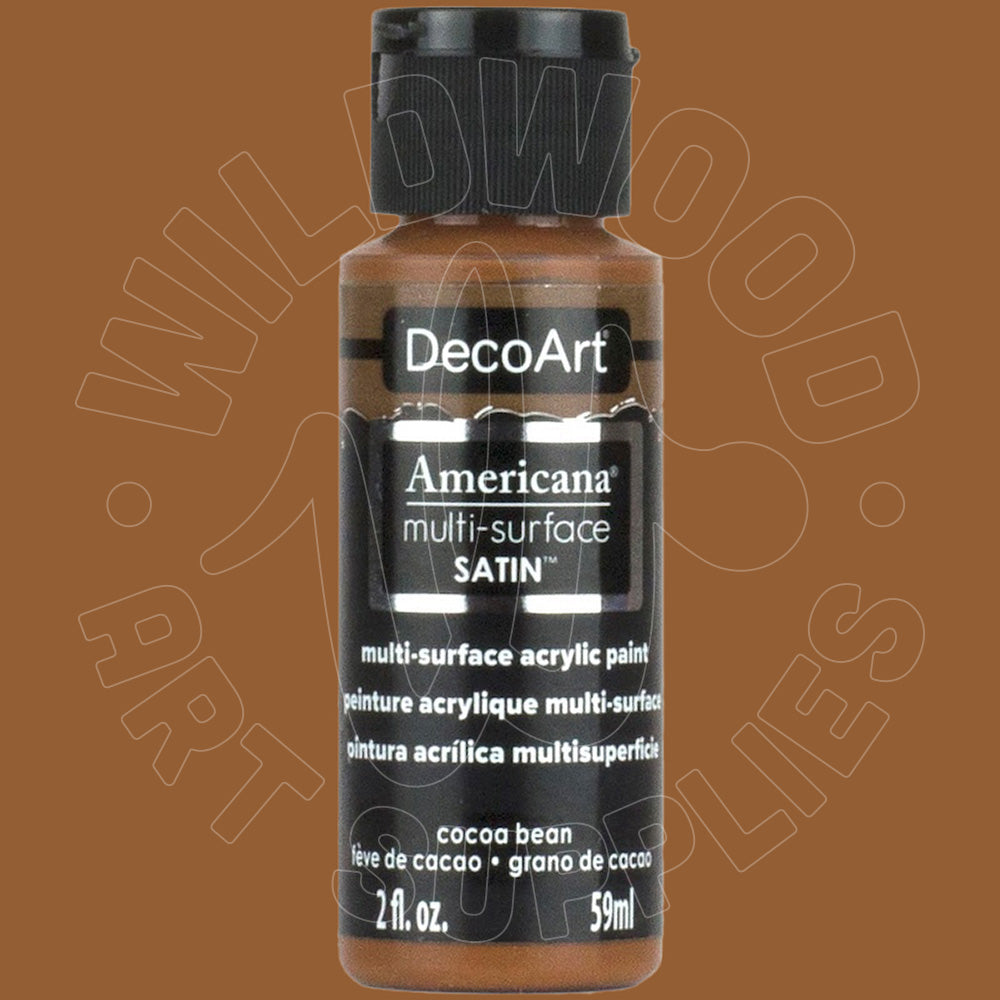 A bottle of DecoArt Americana multi-surface satin acrylic paint in the color 'cocoa bean' (brown), featuring a black cap and black label on a solid brown background.