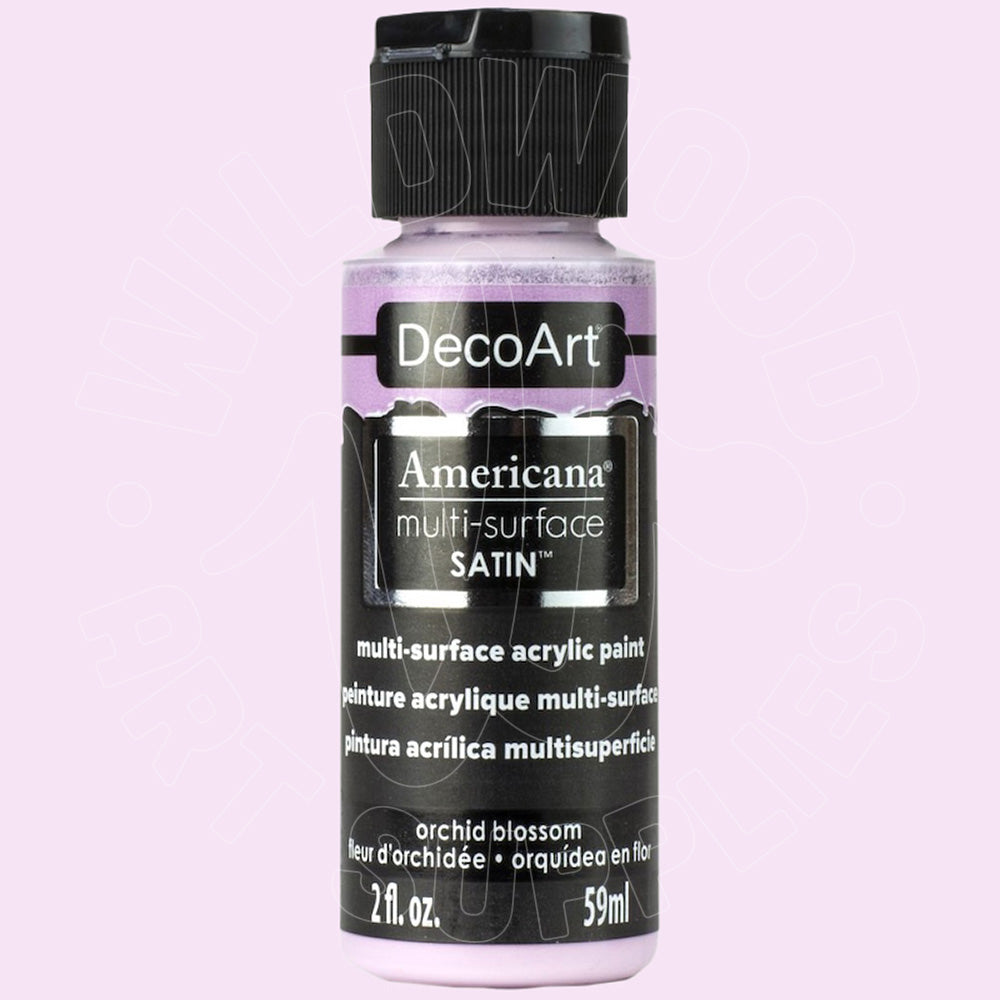 A bottle of DecoArt Americana multi-surface satin acrylic paint in the shade orchid blossom, shown against a solid light pink background.