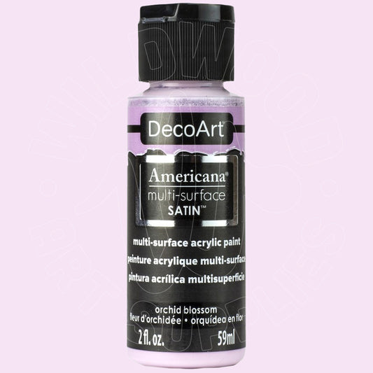 A bottle of DecoArt Americana multi-surface satin acrylic paint in the shade orchid blossom, shown against a solid light pink background.