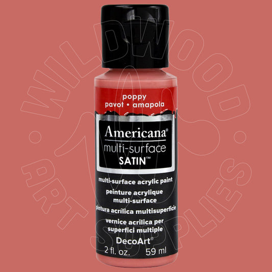 A bottle of DecoArt Americana multi-surface satin acrylic paint in the shade 'poppy' (pavot • amapola), featuring a black cap and a black label with red accents, set against a solid dusty rose background.