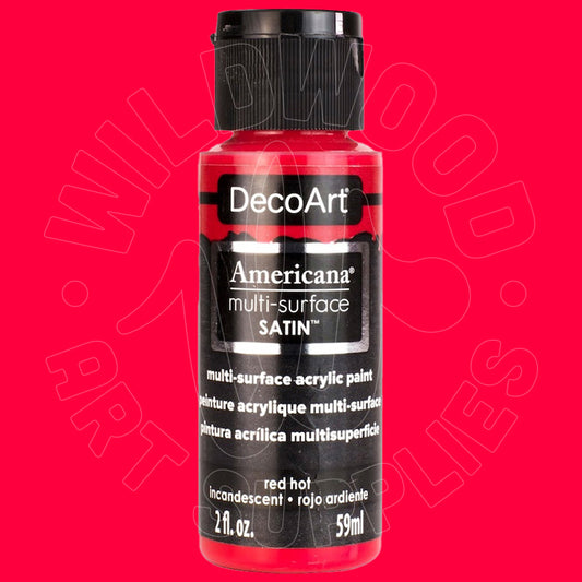 A bottle of DecoArt Americana multi-surface satin acrylic paint in the color 'red hot', shown against a solid bright red background with a faint watermark.