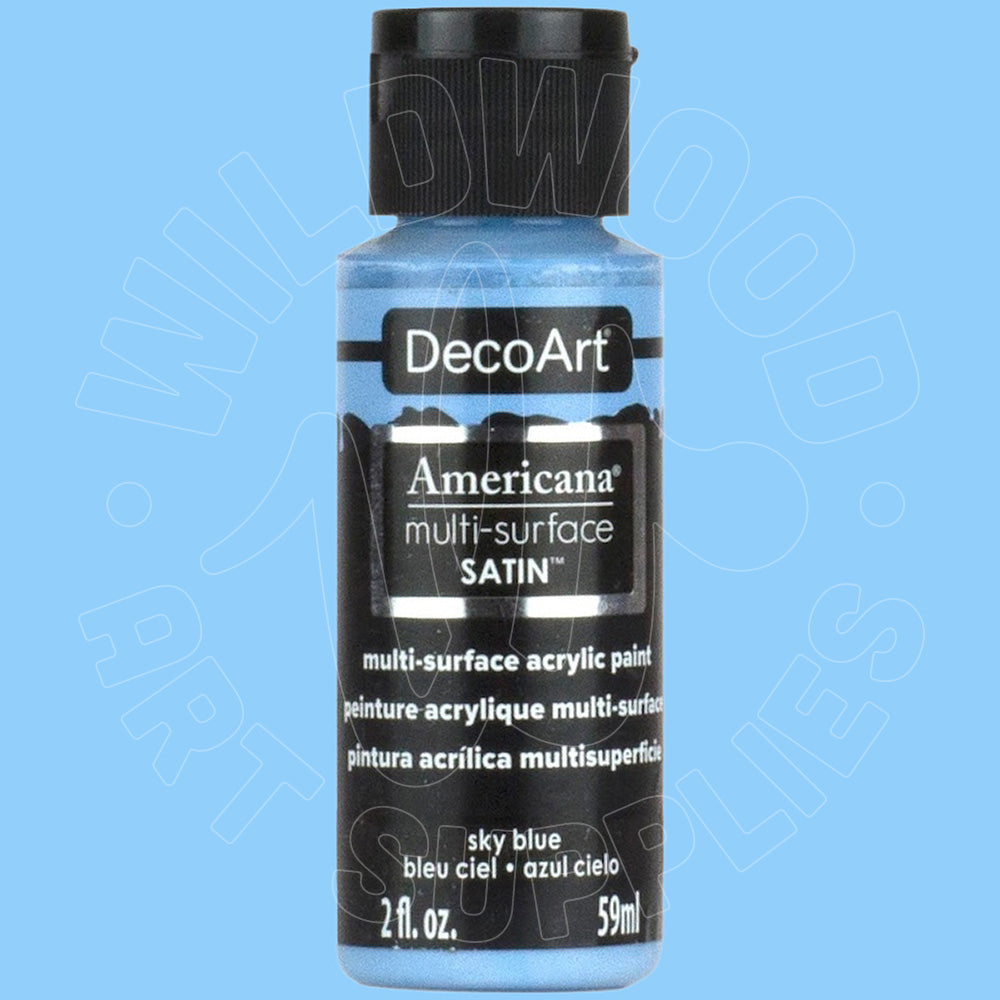 A bottle of DecoArt Americana multi-surface SATIN acrylic paint in the color 'sky blue', shown against a solid light blue background with a faint watermark.