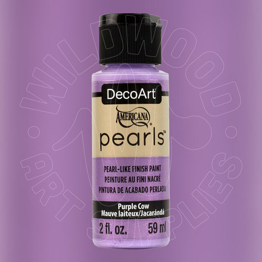 A bottle of DecoArt Americana Pearls acrylic paint in the color 'Purple Cow' (mauve laiteux/jacarandé), featuring a black cap and a beige label with purple text, set against a solid purple background.